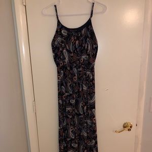 A black dress with designs.